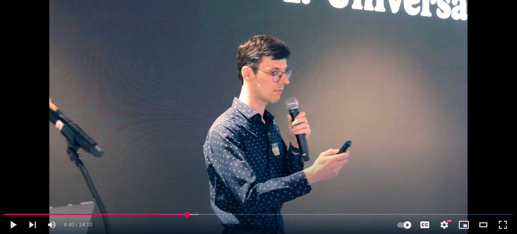 A man looks in confusion at his own clicker.